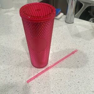 24oz bright Barbie pink studded Starbucks tumbler.